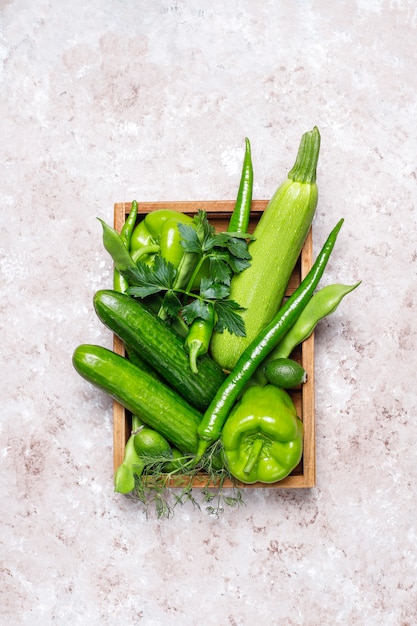 Fresh green vegetables on concrete surface