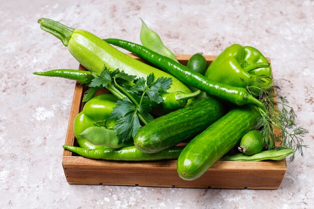 Fresh green vegetables on concrete surface