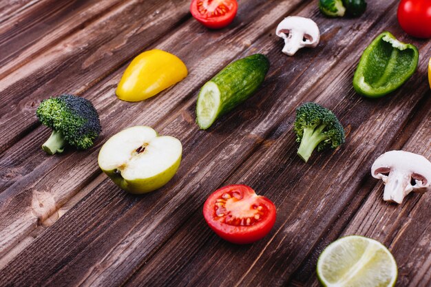 Fresh and healthy food. Yellow and green pepper, lemon, lime, broccoli, tomatoes