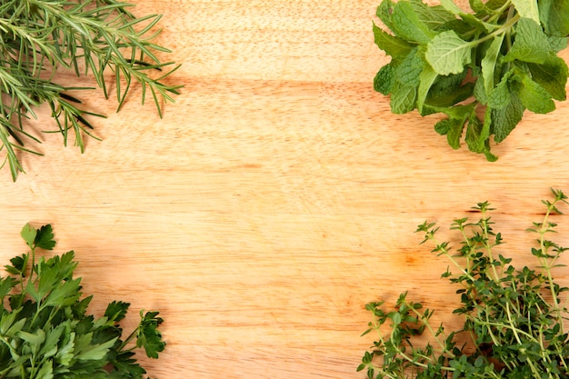 Fresh herbs on chopping board