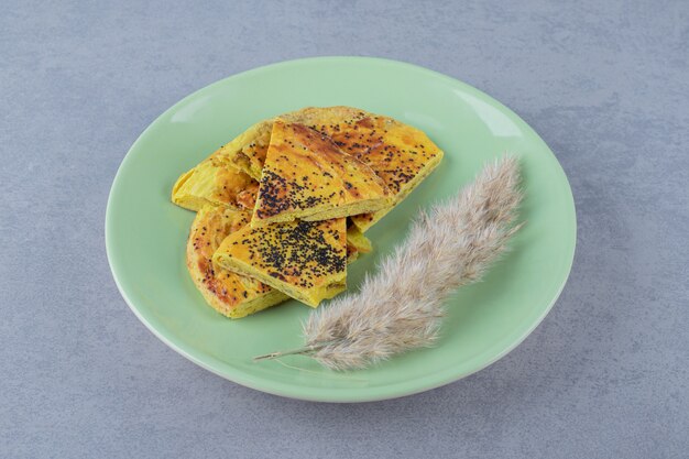 Fresh homemade cookie on green plate