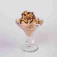 Free photo fresh ice cream with nuts in glass bowl