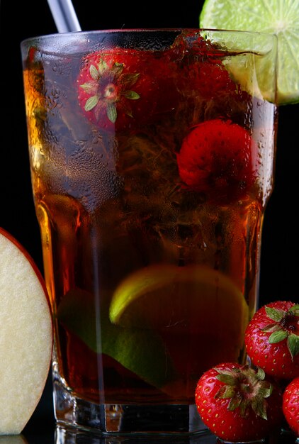 Fresh ice tea with ice and strawberries