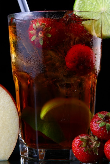 Fresh ice tea with ice and strawberries