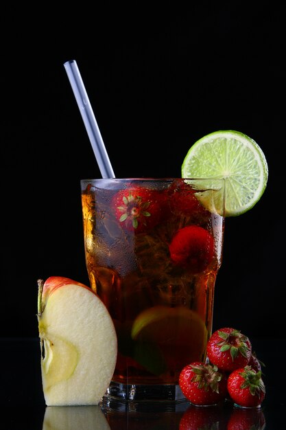 Fresh ice tea with ice and strawberries