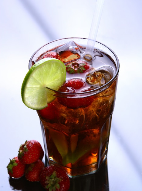 Fresh ice tea with ice and strawberries