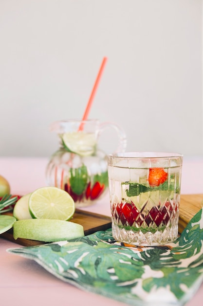 Fresh juice with fruits on chopping board