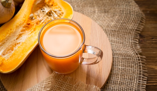 Fresh juice with halved pumpkin arrangement