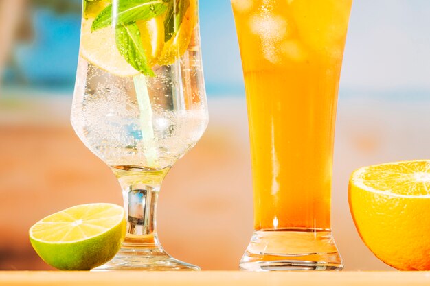 Fresh juicy drinks and sliced lime orange