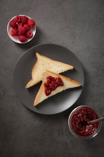 Fresh juicy homemade jam and slices of bread