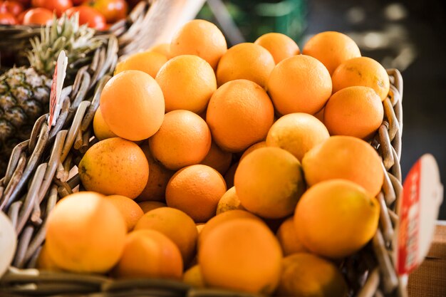 Fresh juicy kumquats in basket at the market
