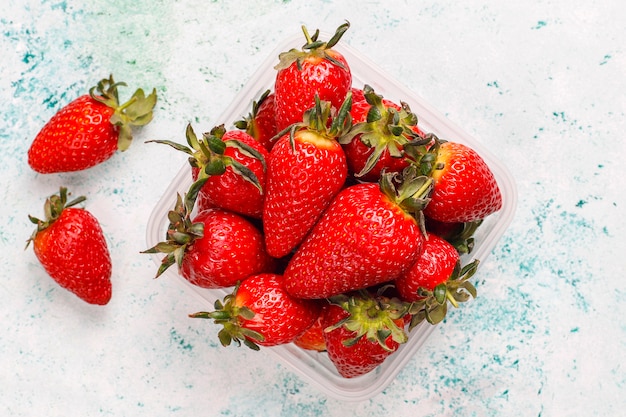 Fresh juicy strawberries on light