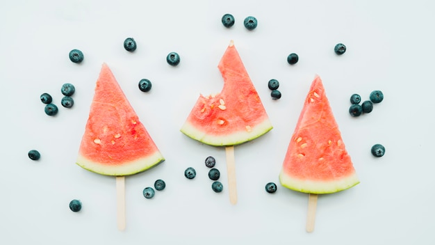 Fresh juicy watermelon popsicle and blueberries