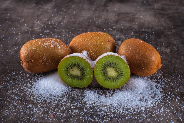 Fresh kiwi fruit covered by the sugar