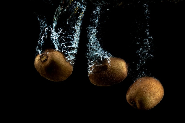 Fresh kiwis in the water