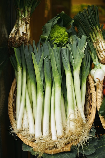 Fresh leek in basket presented outside in market for sale