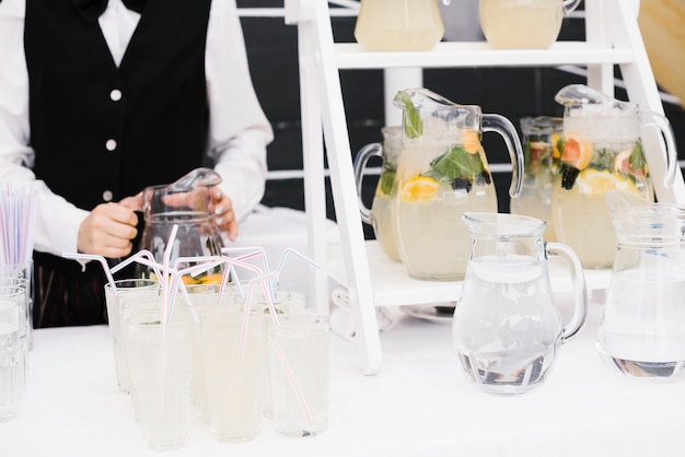 Fresh lemonade with straws on the table