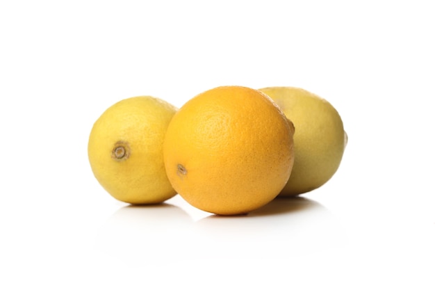 Fresh lemons on a white surface