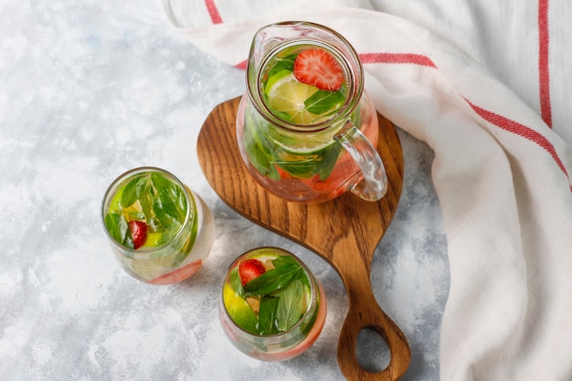 Fresh lime, strawberry and mint infused water, cocktail, detox drink, lemonade. Summer drinks. Health care concept.