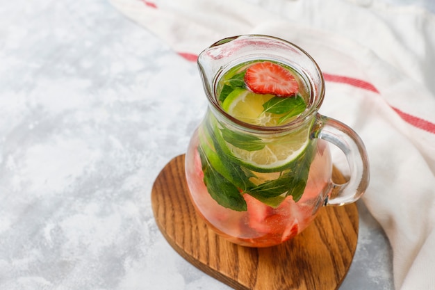 Fresh lime, strawberry and mint infused water, cocktail, detox drink, lemonade. Summer drinks. Health care concept.