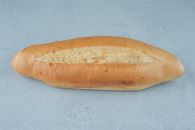 Fresh loaf bread on stone surface