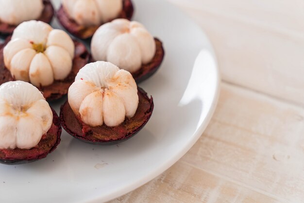 fresh mangosteen on wood