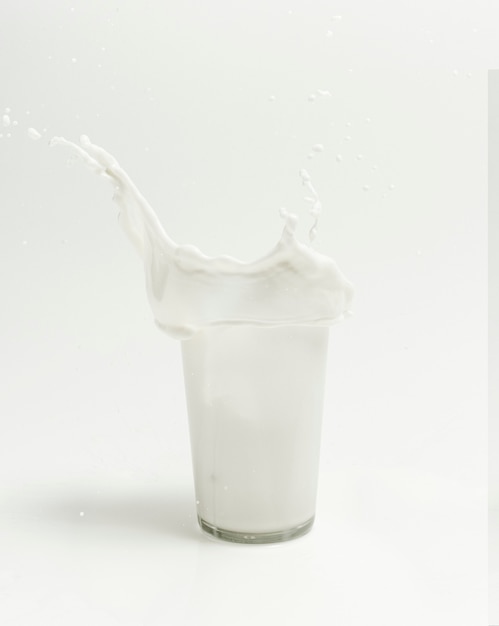 Fresh milk splashing from a glass