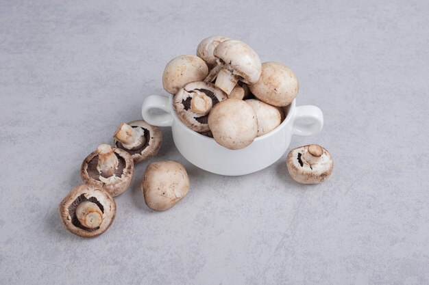 Fresh mushrooms on white plate. 