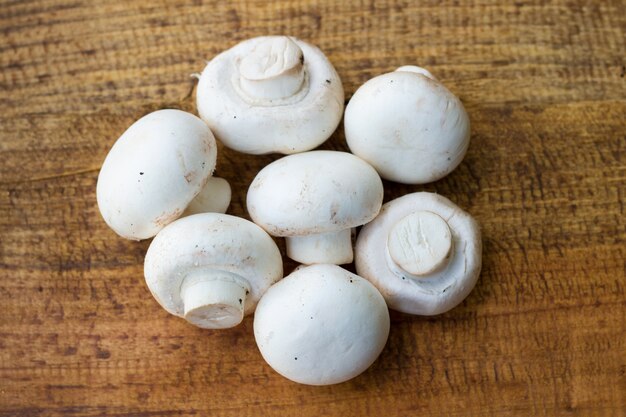 fresh mushrooms on wodden background