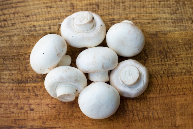 fresh mushrooms on wodden background