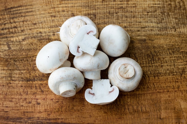 Free photo fresh mushrooms on wodden background