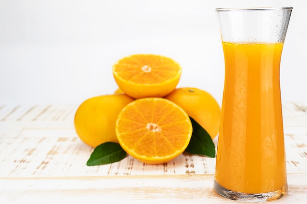 Fresh orange juice fruit drink glass over white  