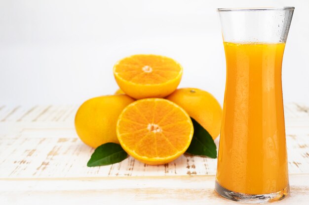 Fresh orange juice fruit drink glass over white  