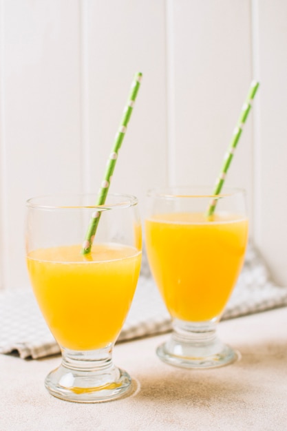 Fresh orange juices with straws 