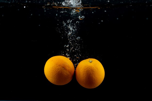 Fresh oranges in the water