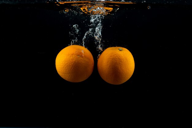 Fresh oranges in the water