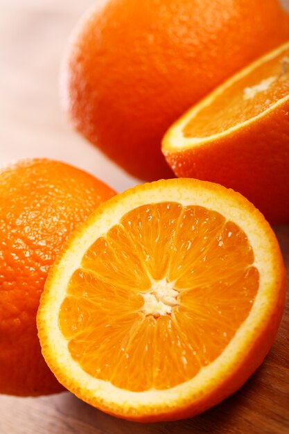 Fresh oranges on wooden board