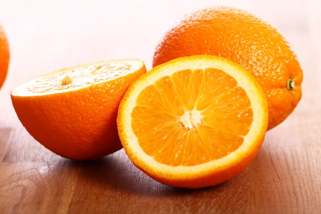 Fresh oranges on wooden board