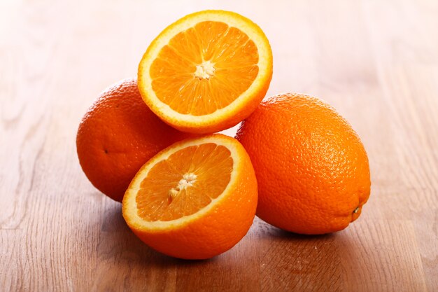 Fresh oranges on wooden board