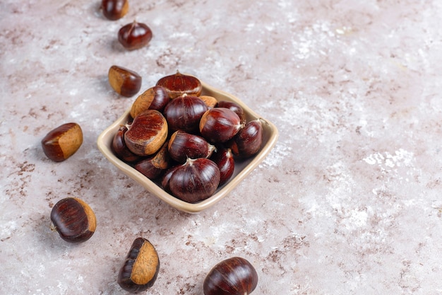 Free photo fresh organic chestnuts.