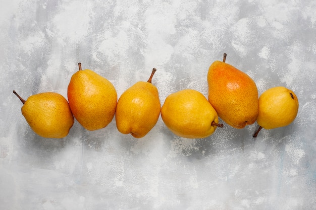 Fresh organic pears on light 