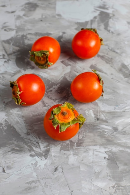 Free photo fresh organic ripe persimmon fruits.