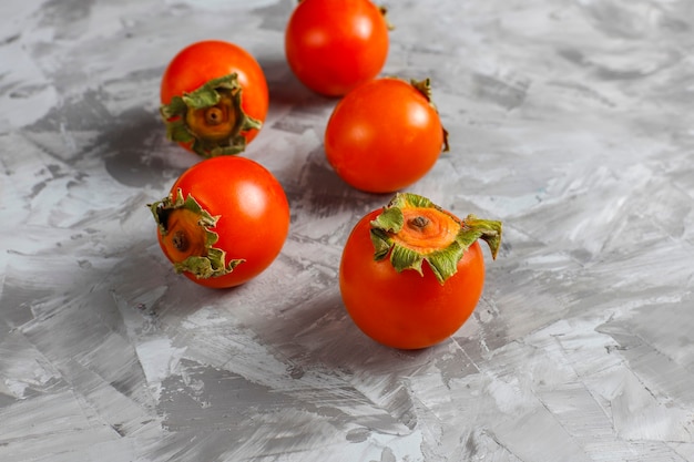 Free photo fresh organic ripe persimmon fruits.