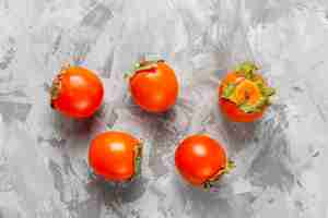 Free photo fresh organic ripe persimmon fruits.