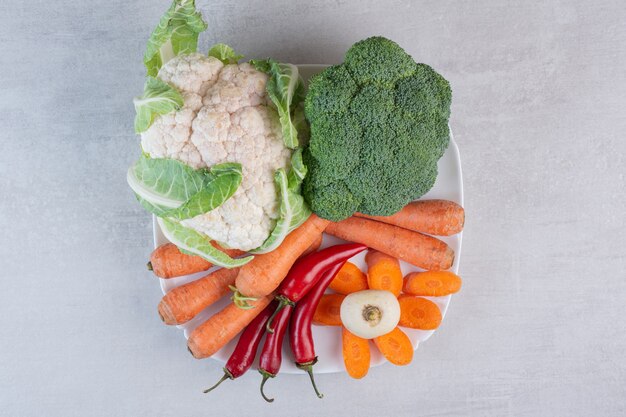 Fresh organic vegetables on white plate. High quality photo