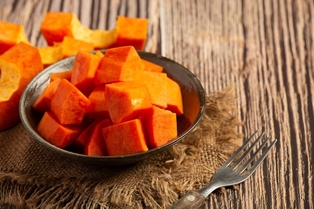 Fresh papaya, cut into pieces, put on a silver plate.