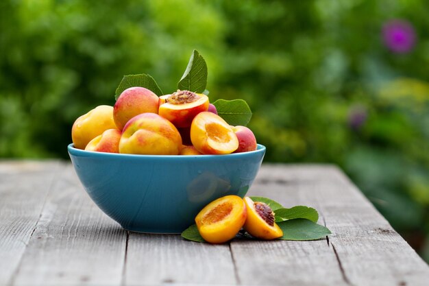 Fresh peaches in blue bowl