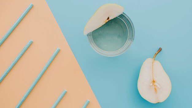 Fresh pear and juice on table