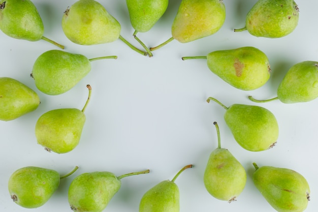 Fresh pears flat lay on a white background