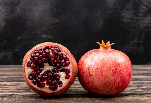 fresh pomegranate on wooden table